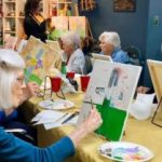 Seniors painting in retirement homes near Covington