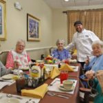 Seniors enjoying lunch at senior living community near New Orleans